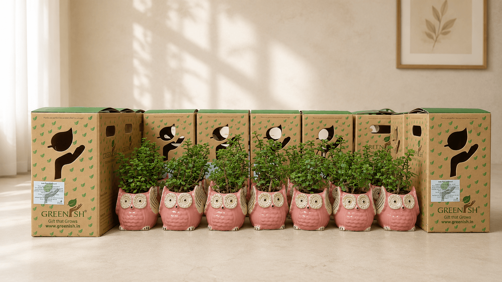 Pink owl planters arranged as baby shower giveaways